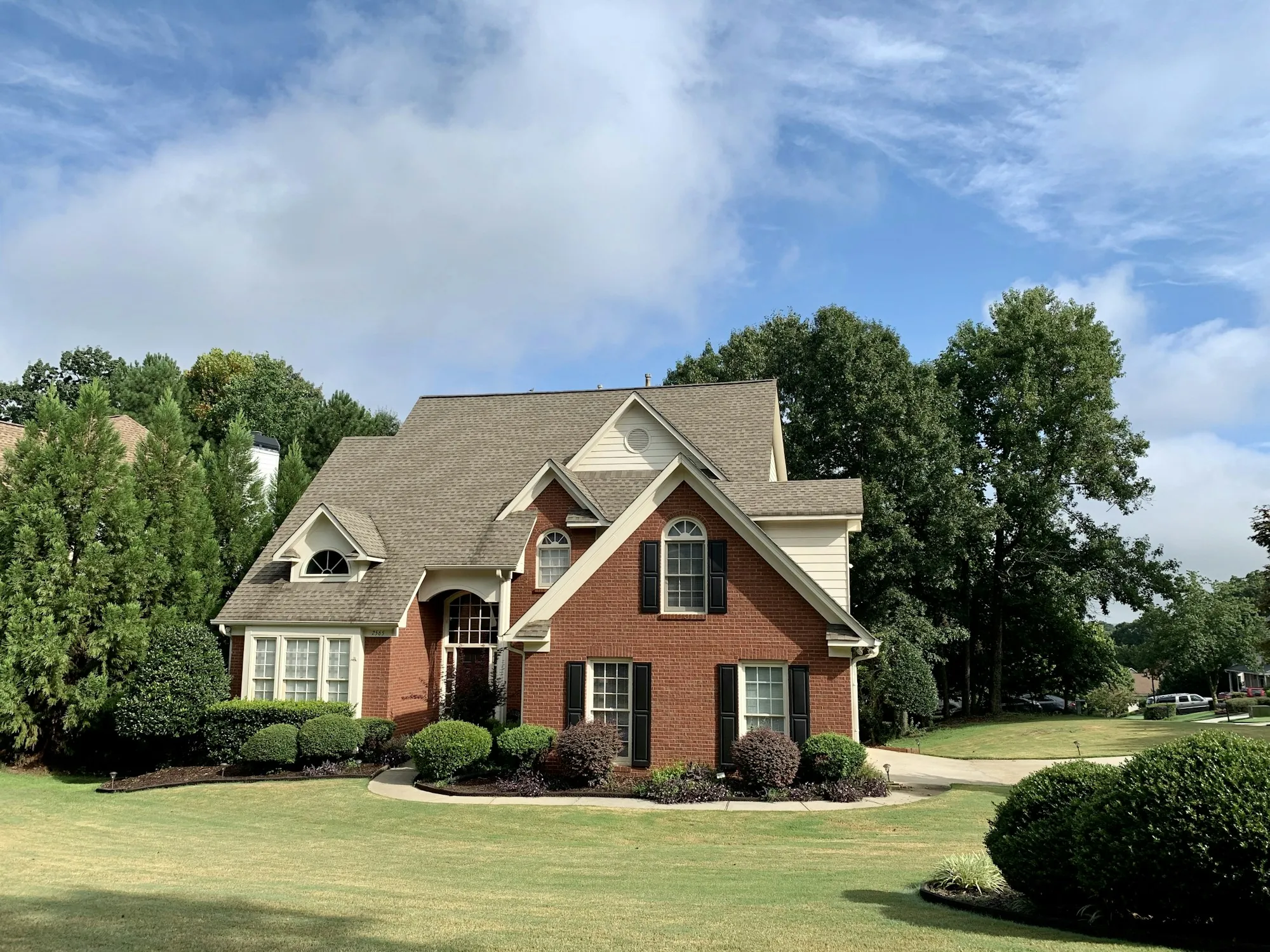 Brick and siding suburban house with a garage