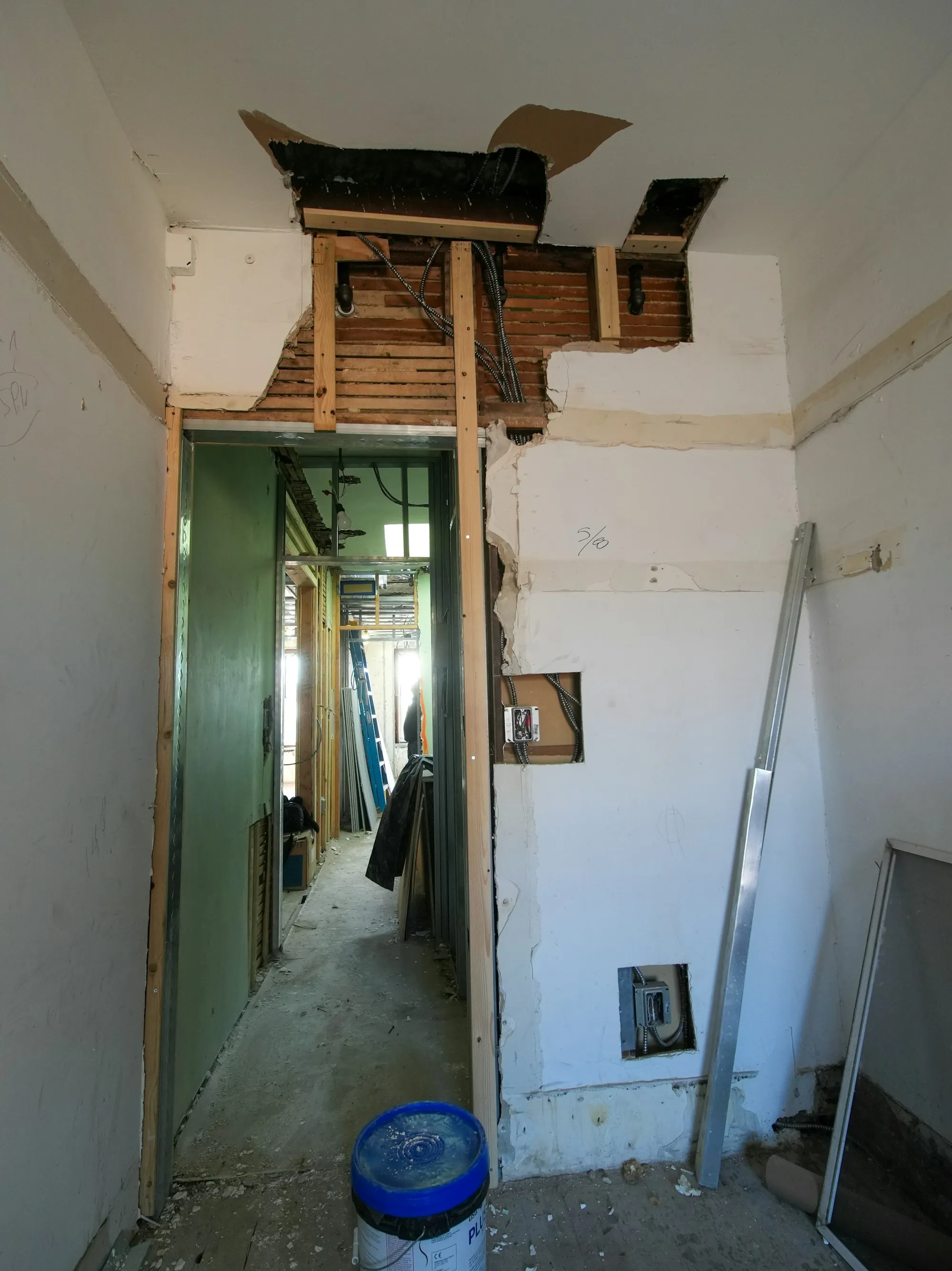 Doorway in a room stripped down for renovation