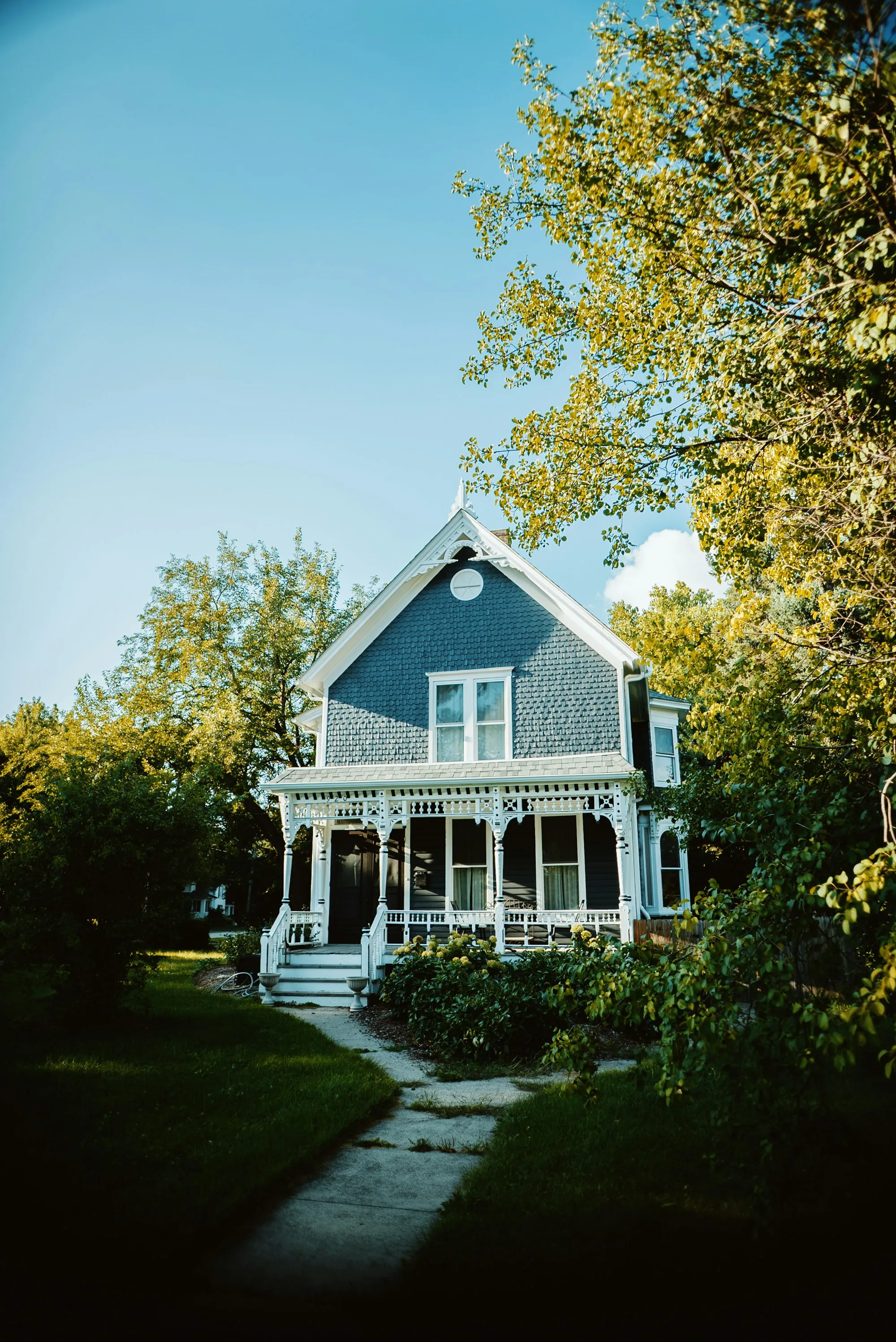 Blue Victorian house with white trim